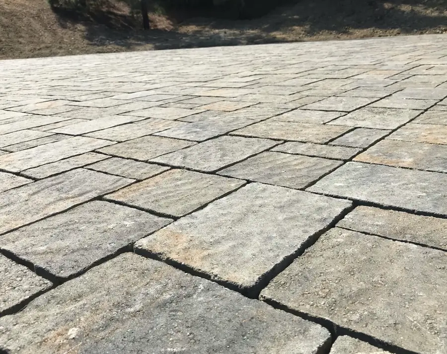 Large-format paver patio with a tumbled stone finish