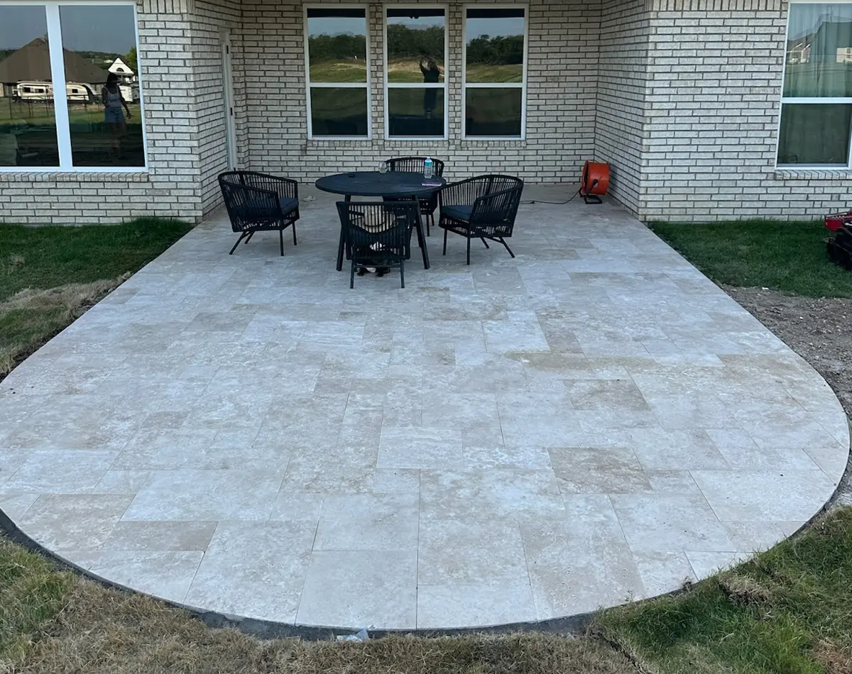 430 sq ft ivory travertine patio with a custom radial edge, built in Arlington, TX